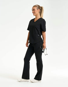 full body with stethascope of black flare scrub pants