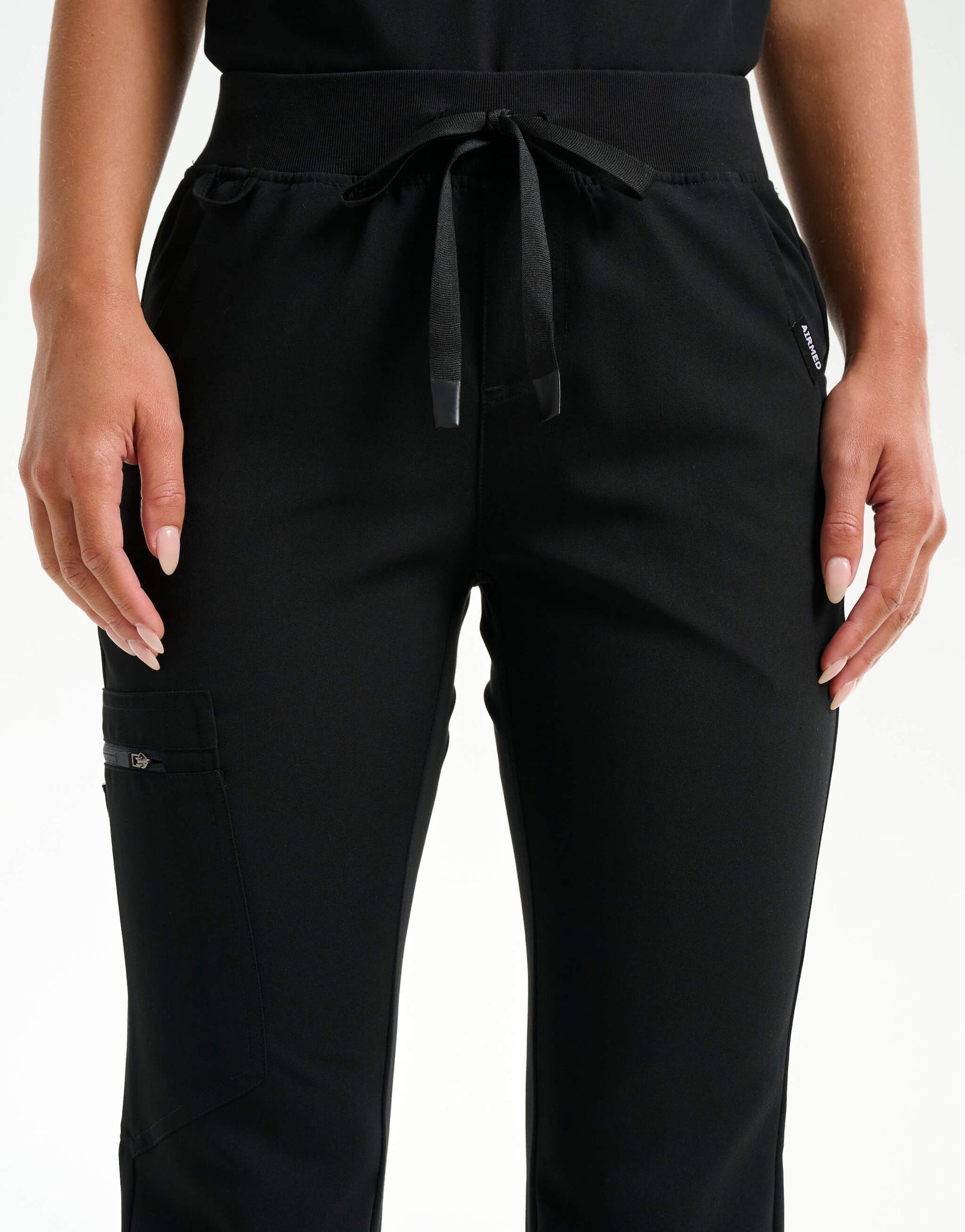 waist of black flare scrub pants