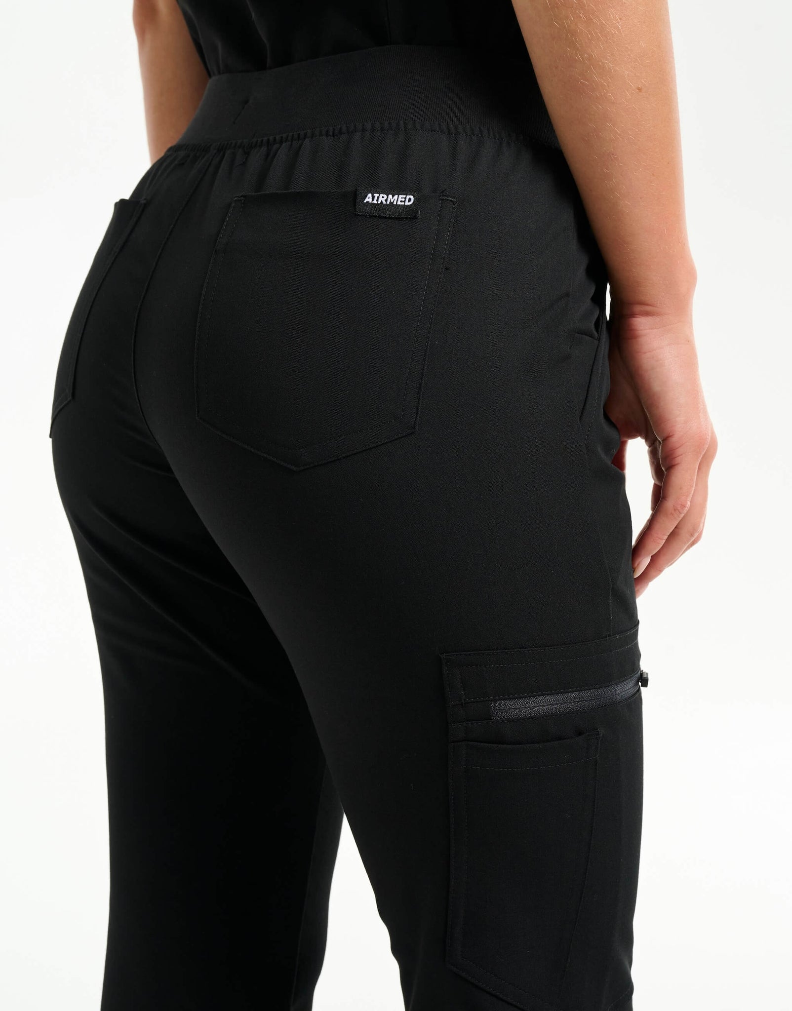 rear of black flare scrub pants