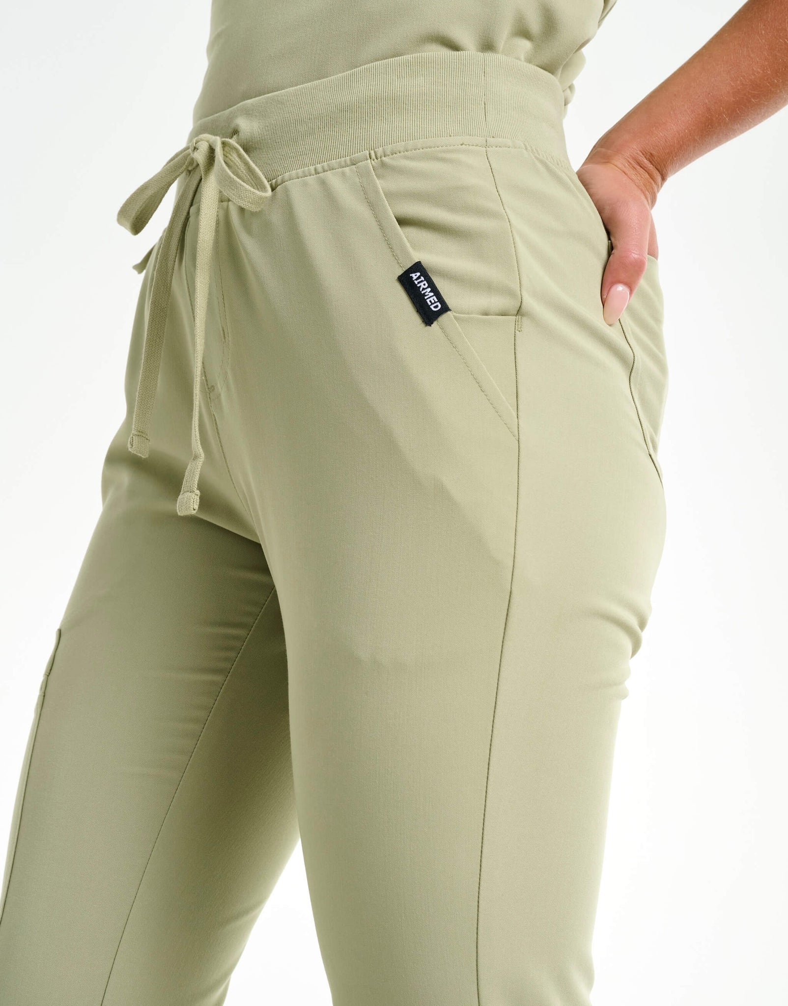 close up of hip pocket of matcha flare scrub pants