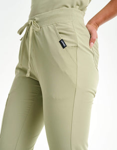 close up of hip pocket of matcha flare scrub pants
