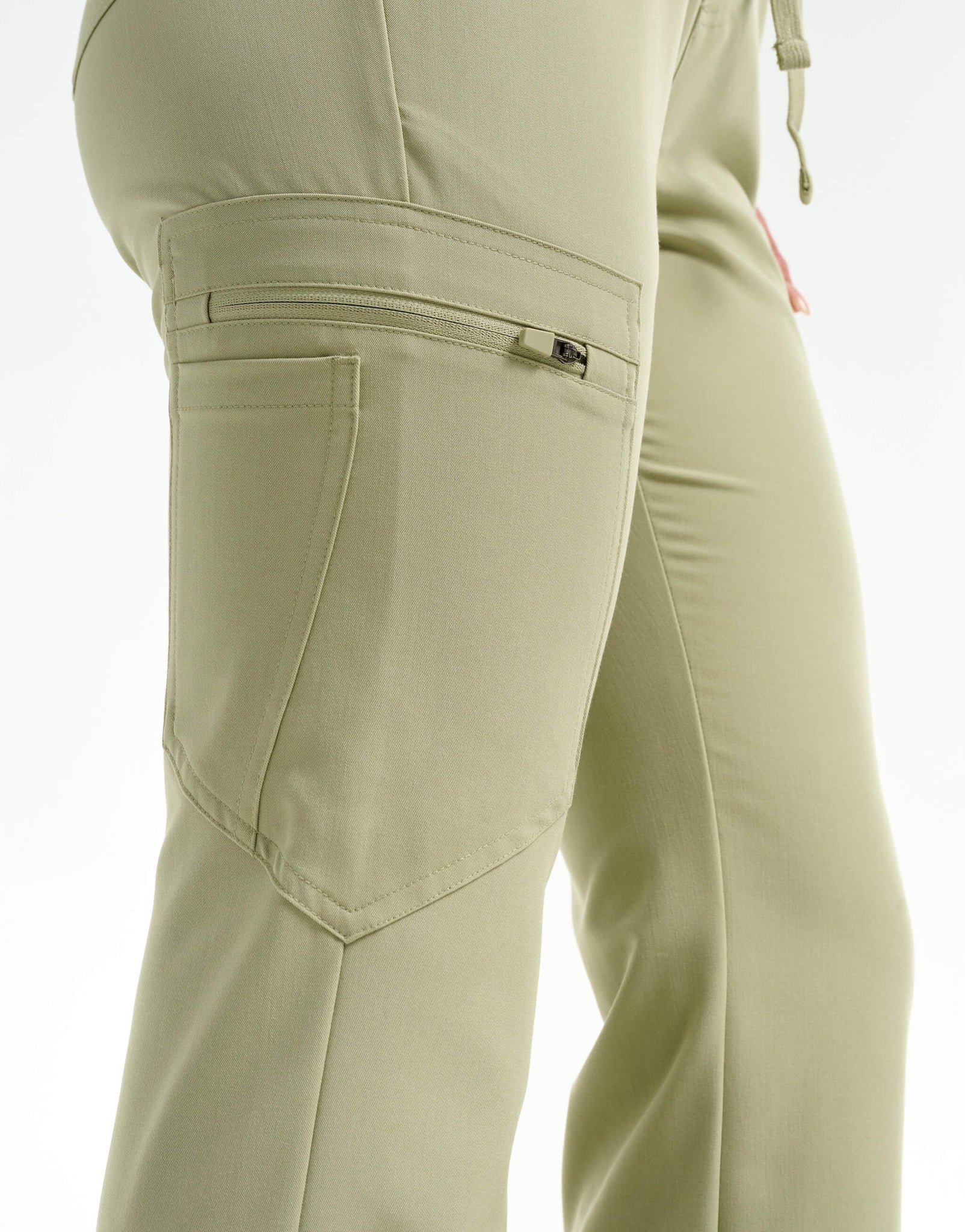 close up of thigh pocket of matcha flare scrub pants
