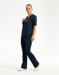 full body with stethascope of midnight navy flare scrub pants