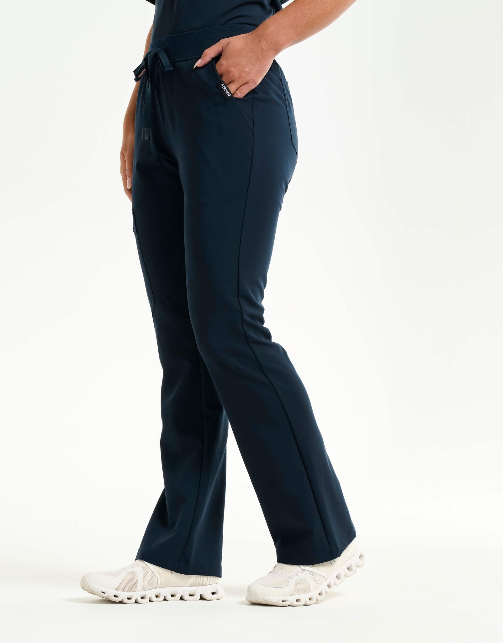 right with hip pocket of midnight navy flare scrub pants
