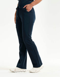 right with hip pocket of midnight navy flare scrub pants