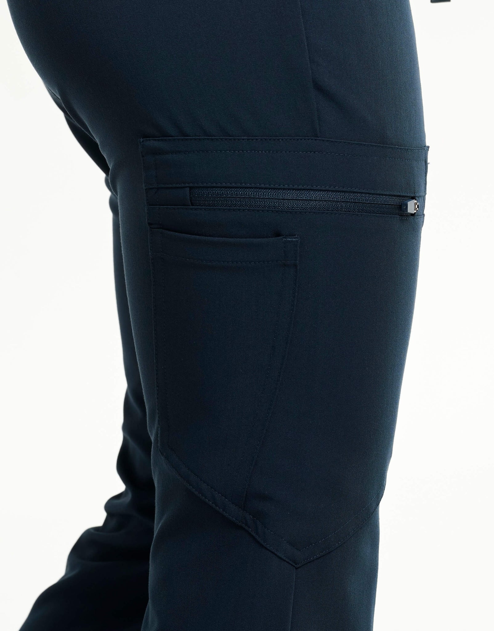 close up of thigh pocket of midnight navy flare scrub pants