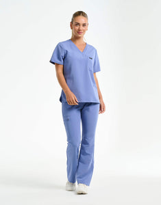 full body of nova blue flare scrub pants