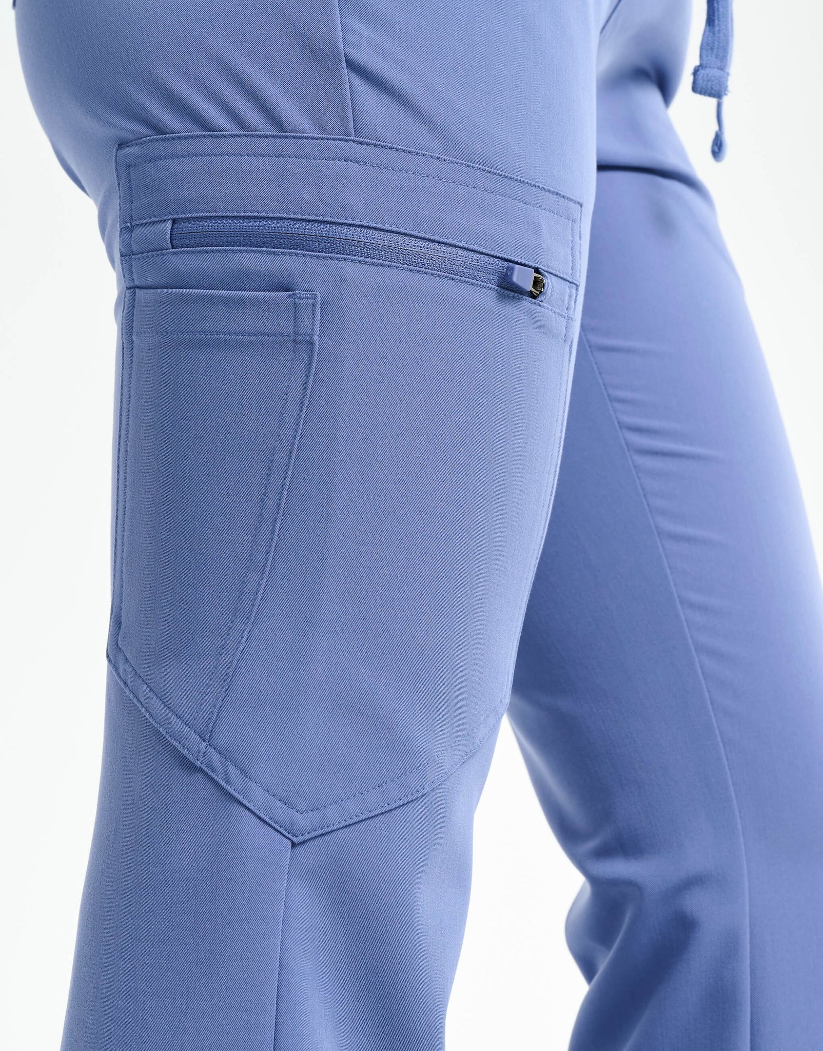 close up of thigh pocket of nova blue flare scrub pants