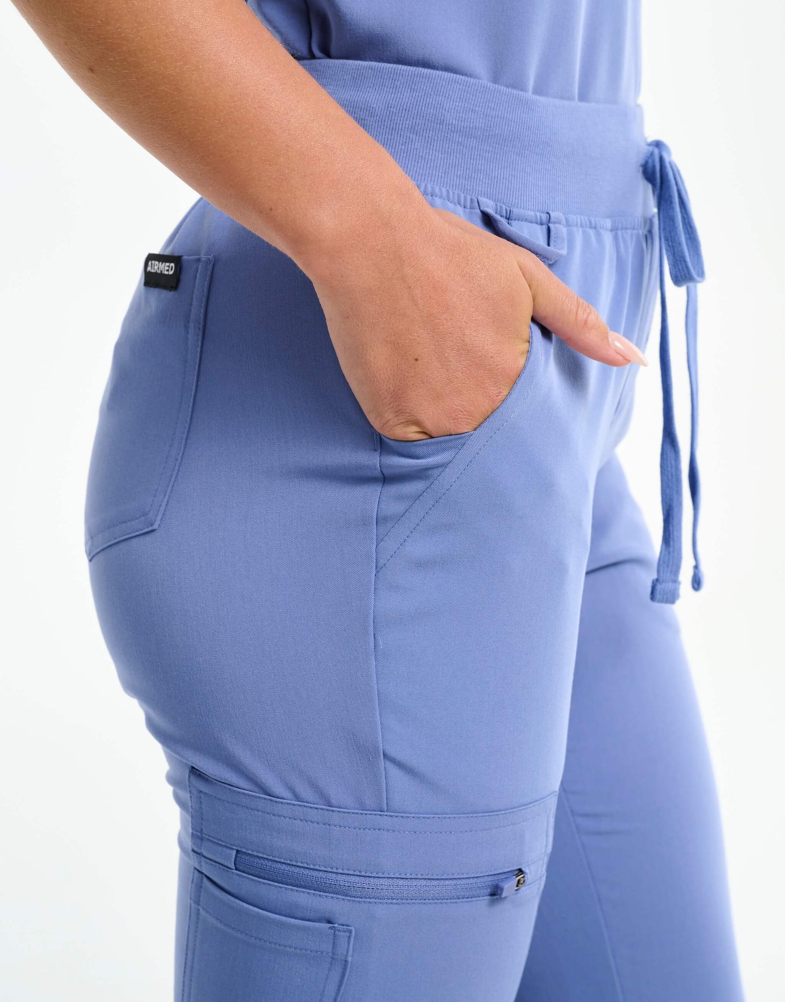 close up of id loop of nova blue flare scrub pants