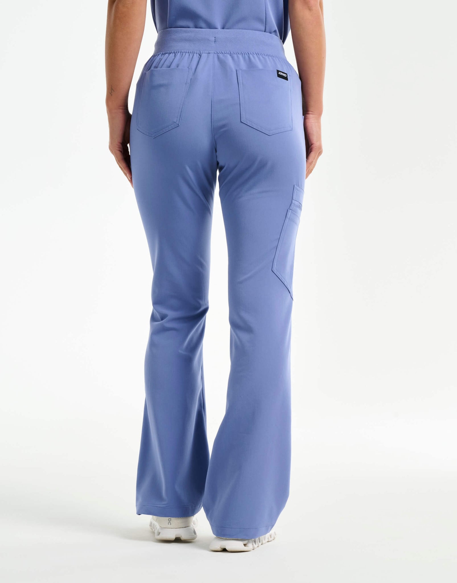 back of nova blue flare scrub pants