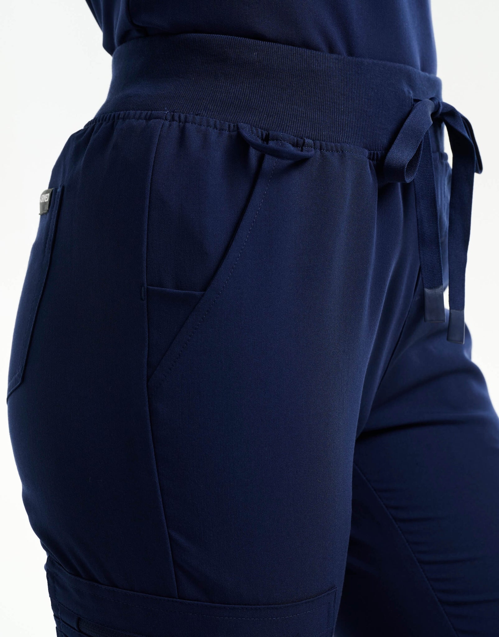 ankle of true navy flare scrub pants