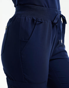 ankle of true navy flare scrub pants