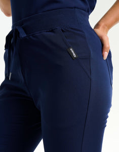 close up of hip pocket of true navy flare scrub pants