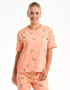 front view of peach crewneck scrub top