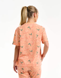 back view of peach crewneck scrub top