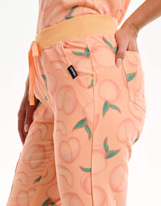 close up of hip pocket of peach jogger scrub pants