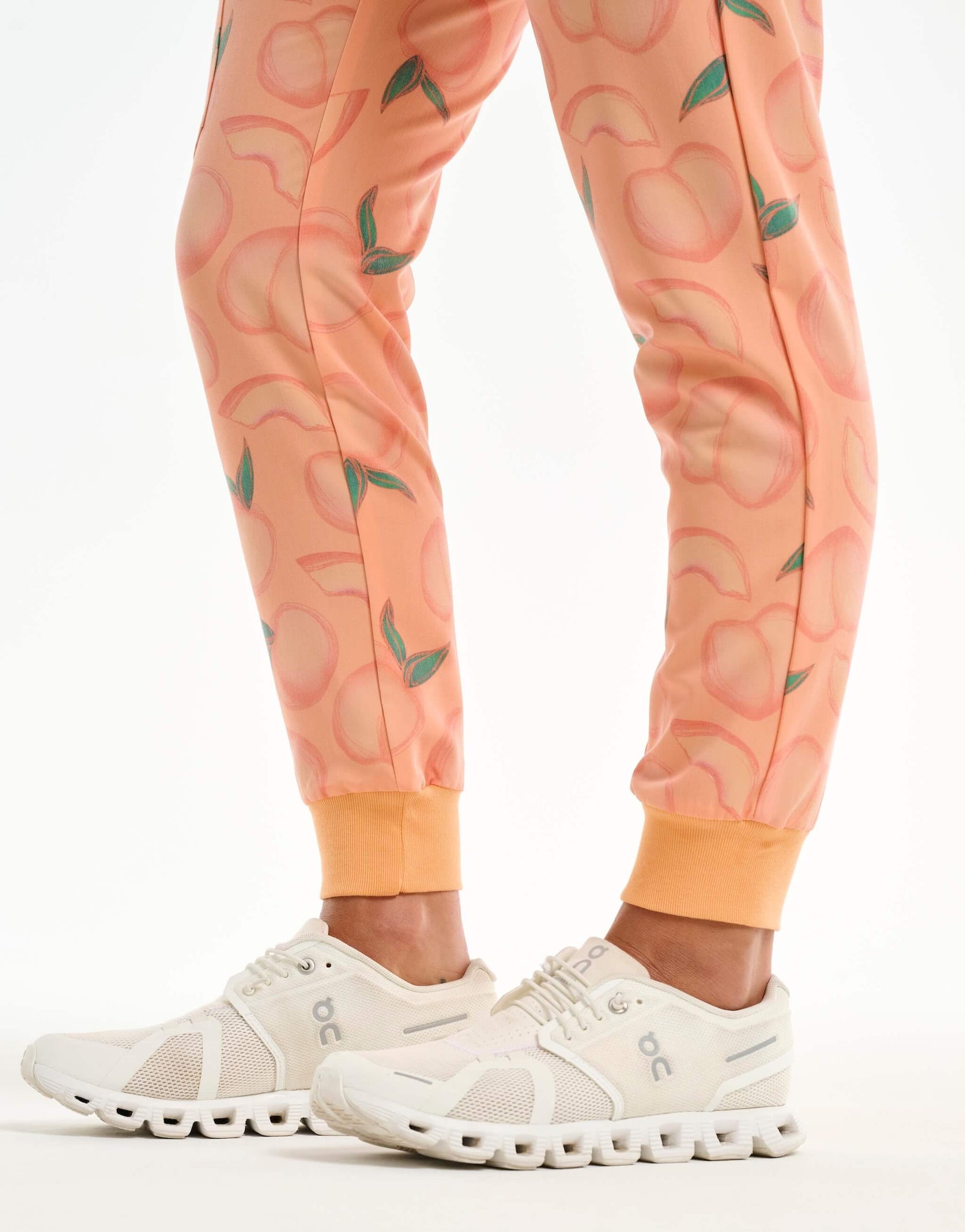 close up of ankle of peach jogger scrub pants