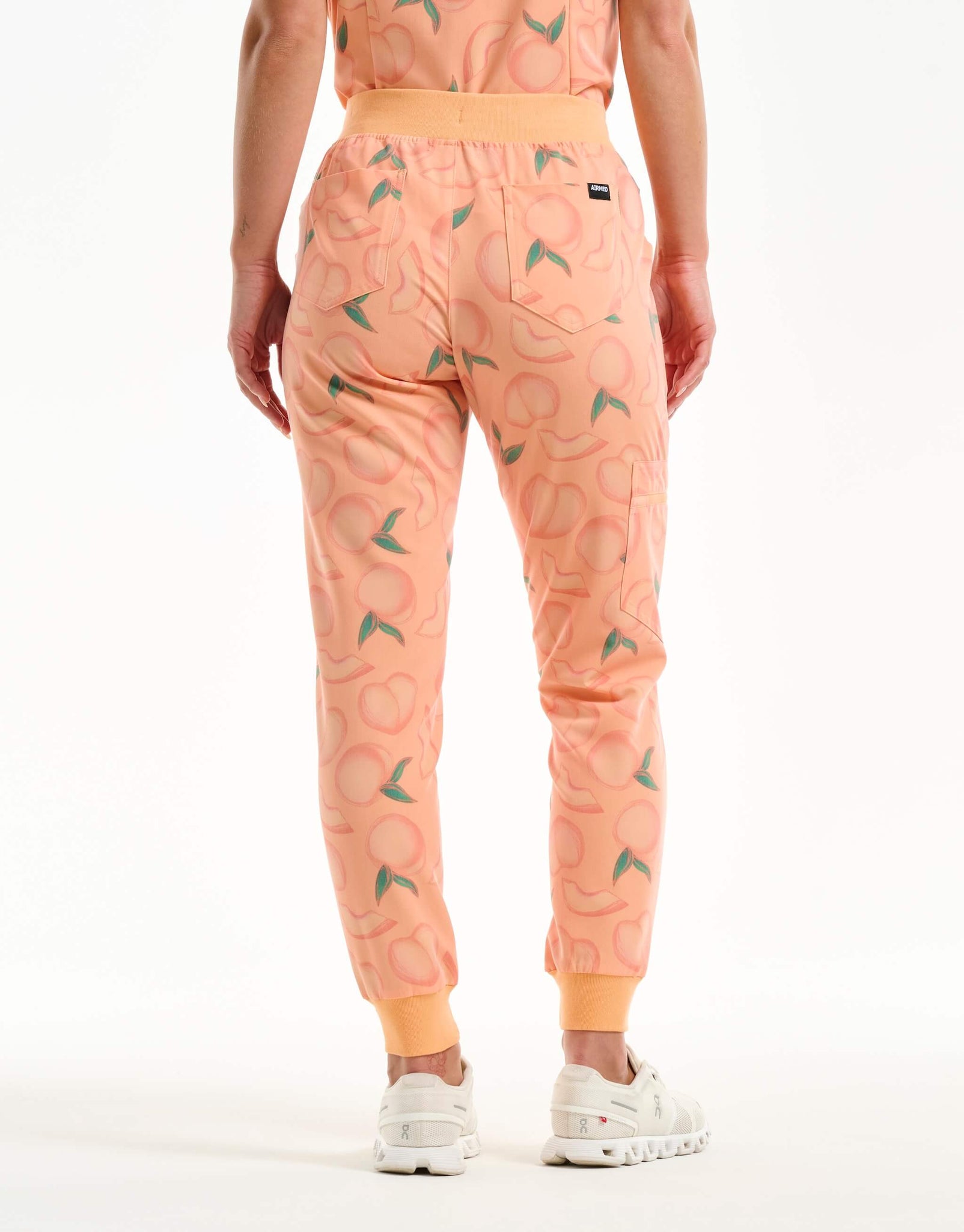 back view of peach jogger scrub pants