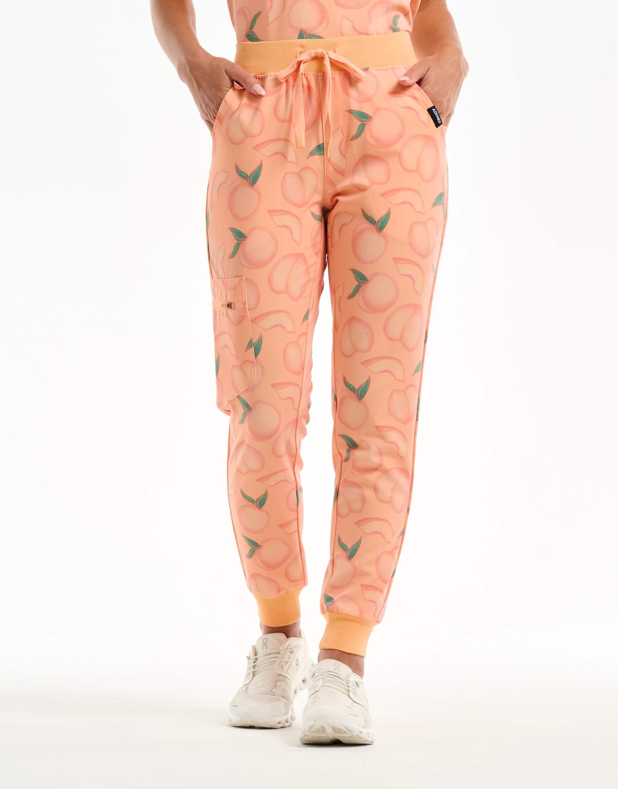 front view of peach jogger scrub pants