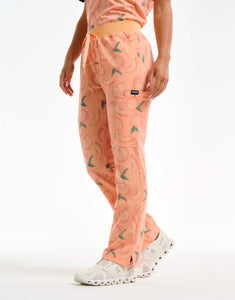 right view with hip pocket of peach multi-pocket scrub pants