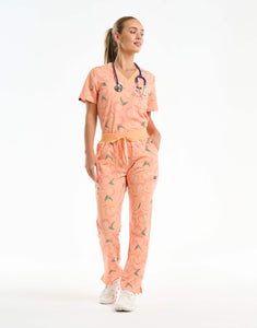 full body with stethascope of peach multi-pocket scrub pants